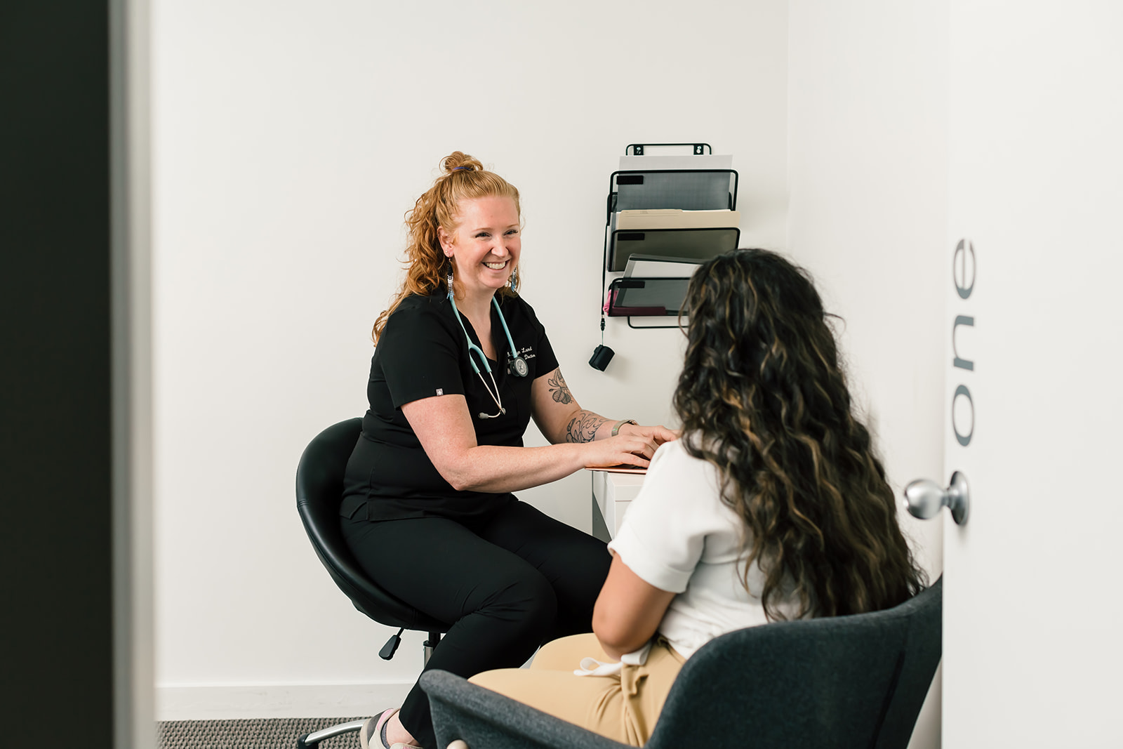 Dr. Land, naturopathic doctor meeting with a patient